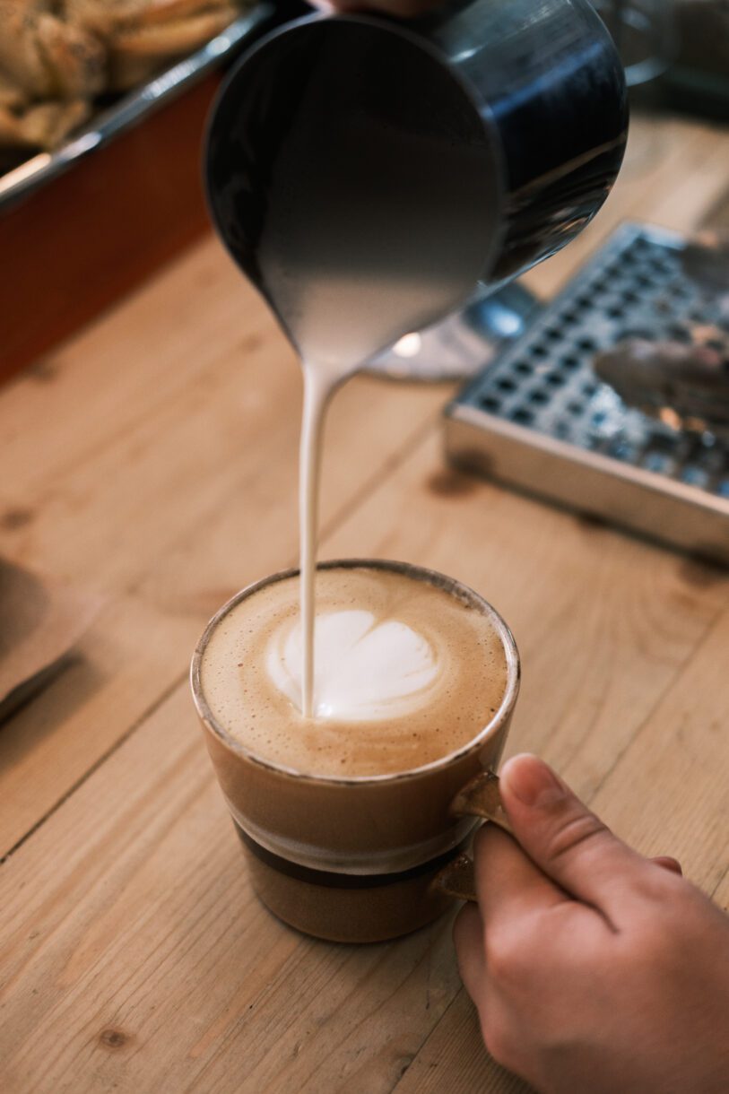 Milk poured into a coffee cup.